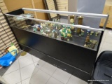 (RFRT) SHOWCASE; BLACK FINISHED SHOWCASE WITH A RAISED SHELF. HAS A LARGE CUBBY IN THE BACK FOR