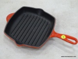 (RFRT) LE CREUSET, ENAMEL CAST IRON, SQUARE SKILLET GRILL PAN WITH A RED COLOR. MEASURES 9