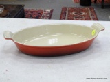 (RFRT) LE CREUSET, RED ENAMEL CAST IRON, OVAL CASSEROLE BAKING DISH WITH 2 HANDLES. MEASURES 13.25