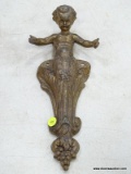 (RFRT) BRASS WALL DECOR OF A CHILD WITH HIS ARMS OUT AT THE TOP AND ORNATE SCOLLING AT THE BOTTOM.