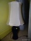 (BDRM2) GINGER JAR TABLE LAMP; BLACKED GLAZED TABLE LAMP WITH A CREAM FABRIC SHADE. MEASURES 27