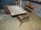 (GARAGE) VINTAGE SCHOOL DESK; WOODEN SCHOOL DESK WITH A METAL BASE THAT HAS STORAGE FOR BOOKS.