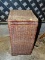(GARAGE) LIDDED WICKER BASKET; TALL, SQUARE WICKER BASKET WITH A HINGED LID. MEASURES 10