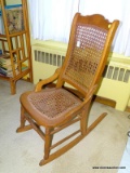 (BDRM2) CANE ROCKING CHAIR; CANE BOTTOM AND BACK ROCKING CHAIR WITH AN ARCHED BACKET DETAILED CROWN,