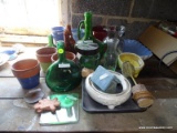 (GARAGE) LOT OF ASSORTED PLANTERS AND BOTTLES' TABLE LOT INCLUDE 5 ASSORTED BOTLES, A SET OF 3