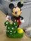 (R2) DISNEY MICKEY MOUSE WITH FLOWERED TOPIARY GARDEN STATUE. SHEARS HAVE BEEN BROKEN OFF. MEASURES