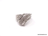 10KT WHITE GOLD 1 CT DIAMOND COCKTAIL RING. SIZE 7 1/4 AND WEIGHS 5.4 GM