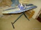 (LDRY) IRONS AND IRONING BOARD; 2 STEAM IRONS- SHARK AND HAMILTON BEACH AND A FOLDING METAL IRONING