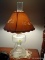 (BD1) LAMP; CONVERTED OIL LAMP WITH CHIMNEY AND PAPER CUT OUT SHADE- 20 IN H