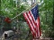 (BYD) FLAG LOT; 3 FLAGS AROUND YARD- 2 US FLAGS ON POLES AND A DON'T TREAD ON ME FLAG ON POLE