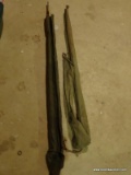 (BASE) VINTAGE FISHING POLES; 2 VINTAGE FISHING POLES IN CANVAS BAGS- ONE IS BAMBOO