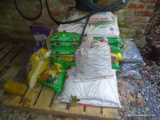 (UNDER PORCH) SOIL AND LIMESTONE; LARGE LOT OF NEW BAGS OF PLANTING SOIL, LIMESTONE, DRAINAGE