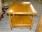 (R3) CHERRY FINISHED SIDE TABLE; SINGLE DRAWER COFFEE TABLE WITH A LOWER SHELF AND LEAF DETAILING ON