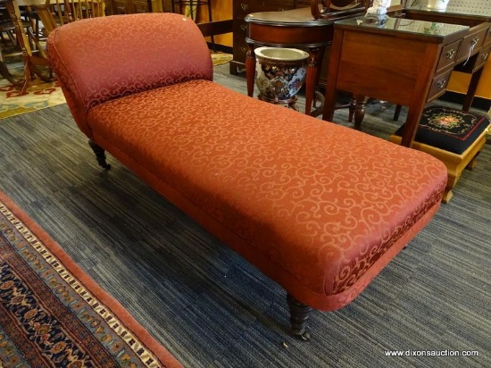 (R1) CHAISE LOUNGE; BURGUNDY, SWIRL ACCENT UPHOLSTERED CHAISE LOUNGE WITH ORIGINAL WOODEN CASTERS.
