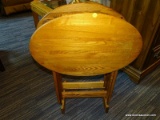 (R3) FOLDING TRAYS WITH STAND; 3 PIECE LOT TO INCLUDE 2 OAK, OVAL TOP, FOLDING TV TRAYS AND A STAND.