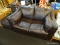 (R4) FAUX LEATHER LOVESEAT AND OTTOMAN; ESPRESSO FAUX LEATHER LOVESEAT WITH OVERSIZED SIZED SIDE AND