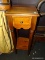 (R5) TELEPHONE TABLE; STAINED TELEPHONE TABLE WITH A SINGLE DRAWER, TAPERED POLE LEGS, AND A LOWER