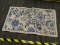 (R7) FLORAL AREA RUG; BLUE AND CREAM COLORED FLORAL MACHINE MADE AREA RUG. MEASURES 48
