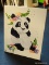 (TABLES) PANDA OIL ON CANVAS; DEPICTS A PANDA CUB SURROUNDED BY FLOWERS. SIGNED 