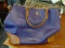 DOONEY & BOURKE LEATHER PURSE - PURPLE; HAS A CENTER ZIPPER POCKET AND POCKETS ON THE SIDE.