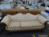 ANTIQUE SUGGS & HARDIN SOFA; EMPIRE STYLE, FLORAL UPHOLSTERED SOFA WITH A CARVED CROWN, ROLLING