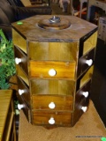 (R4) WALNUT LAZY SUSAN CABINET; HEXAGONAL, TIERED LAZY SUSAN WITH 12 STORAGE CUBBIES AND 6 DRAWERS.