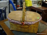 (R6) WICKER PICNIC BASKET; FABRIC LINED, OBLONG PICNIC BASKET WITH 2 LIFT UP LIDS, AN ARCHED HANDLE,