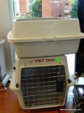 PETMATE PET TAXI ANIMAL CRATE FOR A SMALL ANIMAL. MEASURES 10.5