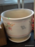 JARDINIERE; CREAM COLORED JARDINIERE WITH A HAND PAINTED FLORAL PATTERN. MEASURES 12