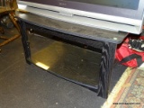 (R8) TV STAND; BLACK FINISHED, OAK GRAIN TV STAND WITH ROUNDED FRONT AND A LOWER GLASS SHELF.