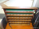 SMC HANGING RACK; WOODEN, 6 SHELF RACK WITH 8 ROUND GROOVES ON EACH SHELF. MEASURES 17