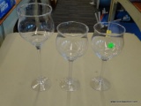 (R2) LOT OF GLASS CANDLE STICKS; 3 PIECE SET OF WINE GLASS SHAPED CANDLE STICKS. 2 MEASURE 10.75