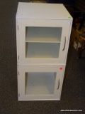 STACKING CABINETS; 2 PIECE SET OF WHITE COLORED, WOODEN STACKING CABINETS WITH A GLASS CABINET DOOR.