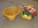 WICKER BASKETS; 2 PIECE LOT TO INCLUDE A LARGE OVAL BASKET AND A SMALLER OVAL BASKET WITH ARTIFICIAL