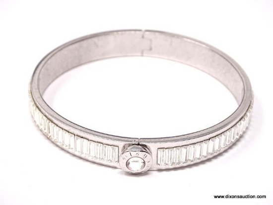 DAZZLING DESIGNER SIGNED, HENRI BENDEL, CRYSTAL BAGUETTE BANGLE BRACELET. THIS SILVER TONE TREASURE