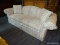 (R2) HIGHLAND HOUSE CAMELBACK SOFA; ROLL ARM, CAMELBACK SOFA WITH A PEACH, PINK, AND LIGHT BLUE