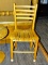 (R2) LADDER BACK SIDE CHAIR; OAK SIDE CHAIR WITH A LADDER BACK, A SLAT SEAT, AND A BOX STRETCHER.