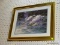 (WALL) FRAMED SWAN PRINT; DEPICTS 2 SWANS WADING THROUGH A LILLY PAD COVERED POND. SITS IN A GOLD