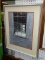 (WALL) FRAMED PRINT; DEPICTS A SCENE OF A FARMHOUSE LIVING ROOM FROM THE OUTSIDE WINDOW. DOUBLE