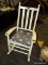 (R3) VINTAGE ROCKING CHAIR; WHITE PAINTED, WOODEN, SLAT BACK ROCKING CHAIR WITH A LIGHT HOUSE