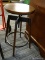 (R4) SCREW BAR STOOL; ROUND WODEN SEAT, SWIVEL BAR STOOL WITH A WOODEN AND GRAY FINISHED METAL BASE.