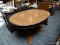 (R1) DOUBLE PEDESTAL KITCHEN TABLE; WALNUT GRAIN, MID CENTURY MODERN OVAL TABLE WITH METAL URN