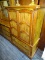 (R1) GENTLEMAN'S CHEST; WALNUT, COUNTRY STYLE GENTLEMAN'S CHEST WITH 2 ARCHED TOP DOORS THAT REVEALS