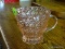 (R1) PINK DEPRESSION GLASS CREAMER WITH A HOLIDAY PATTERN.