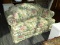 (R1) ADAMS PIERCE LOVESEAT; FLORAL UPHOLSTERED ROLL ARM SOFA WITH A THROW PILLOW AND SKIRT. MEASURES