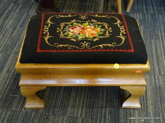 (WALL) FOOT STOOL; FLORAL NEEDLEPOINT UPHOLSTERED STOOL WITH AN OAK FRAME AND CABRIOLE LEGS.
