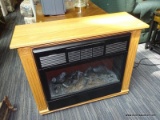 (R2) HEAT SURGE FIREPLACE CABINET HEATER; OAK GRAIN, ELECTRIC, MOBILE FIREPLACE CABINET HEATER.