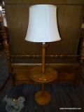 (R2) FLOOR LAMP WITH SHELF; OAK, POLE FLOOR LAMP WITH A MIDDLE SHELF/TRAY AND A CREAM COLORED SHADE.