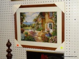 (WALL) FRAMED PRINT; DEPICTS A PATIO SCENE WITH AN OCEAN IN THE BACKGROUND. SITS IN AN OAK GRAIN