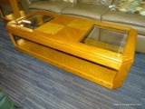 (R3) GLASS TOP COFFEE TABLE; OAK, CUT CORNER COFFEE TABLE WITH A LOWER SHELF AND 2 BEVELED GLASS